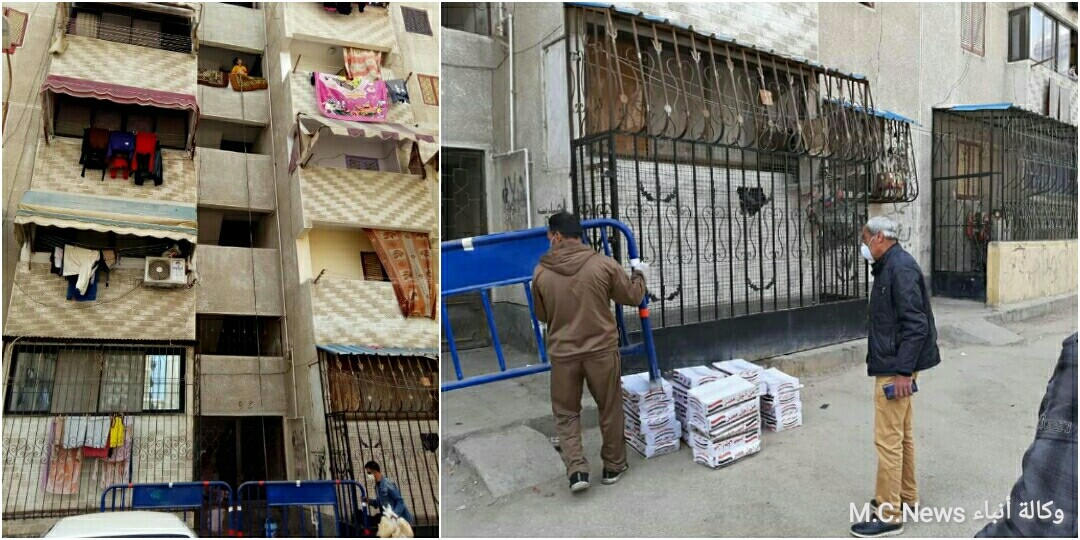 لحظة توزيع الوجبات الغذائية على سكان العمارتين الذي وضعوا قيد الحجر المنزلي فى بورسعيد